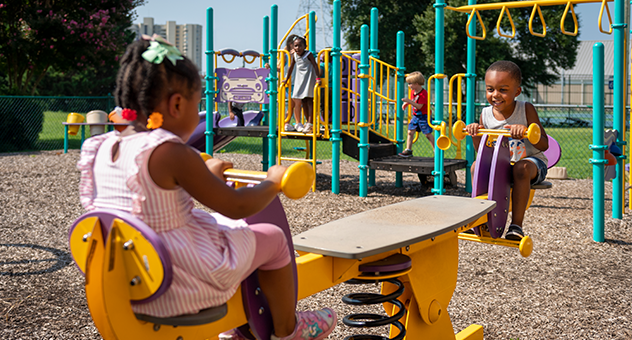 Two children playing on a playground