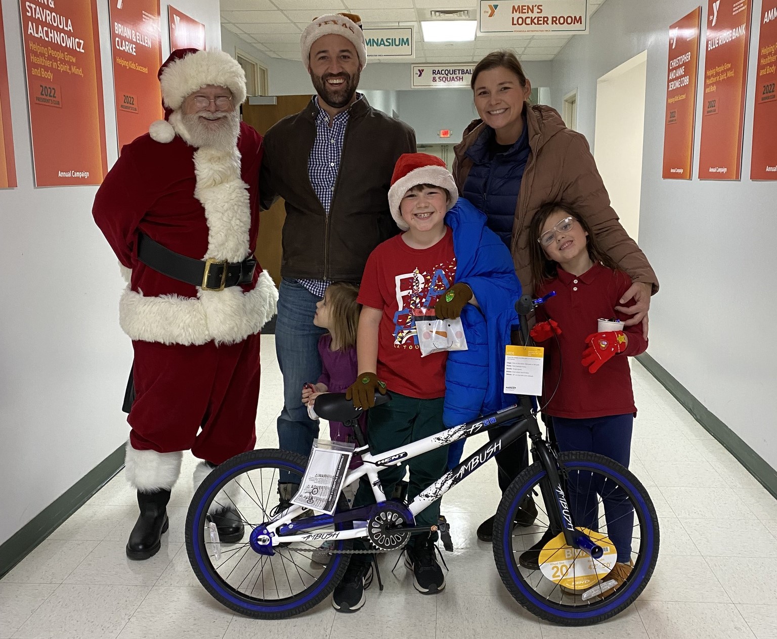 Family smiling with Santa
