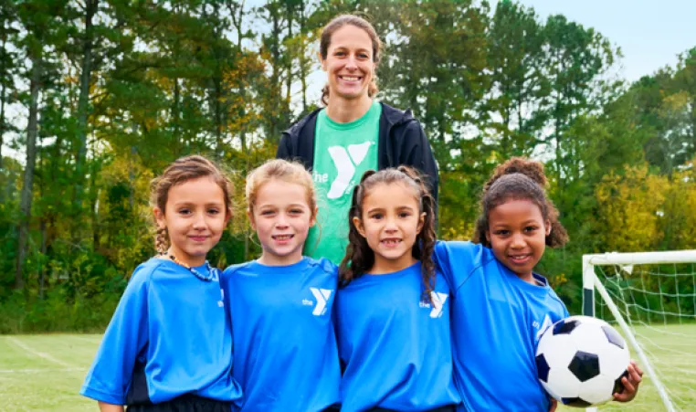 Sports coach with team