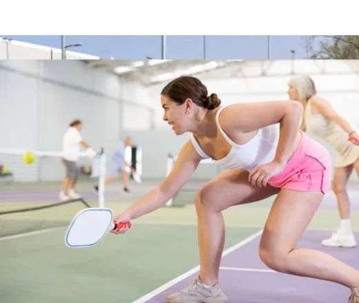 Two people playing pickleball.