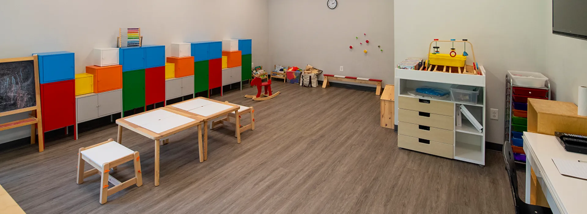Child Watch area with toys and tables for kids to play