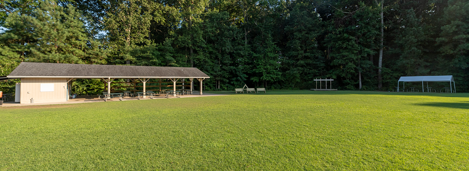 Outside recreation area with field and pavillion